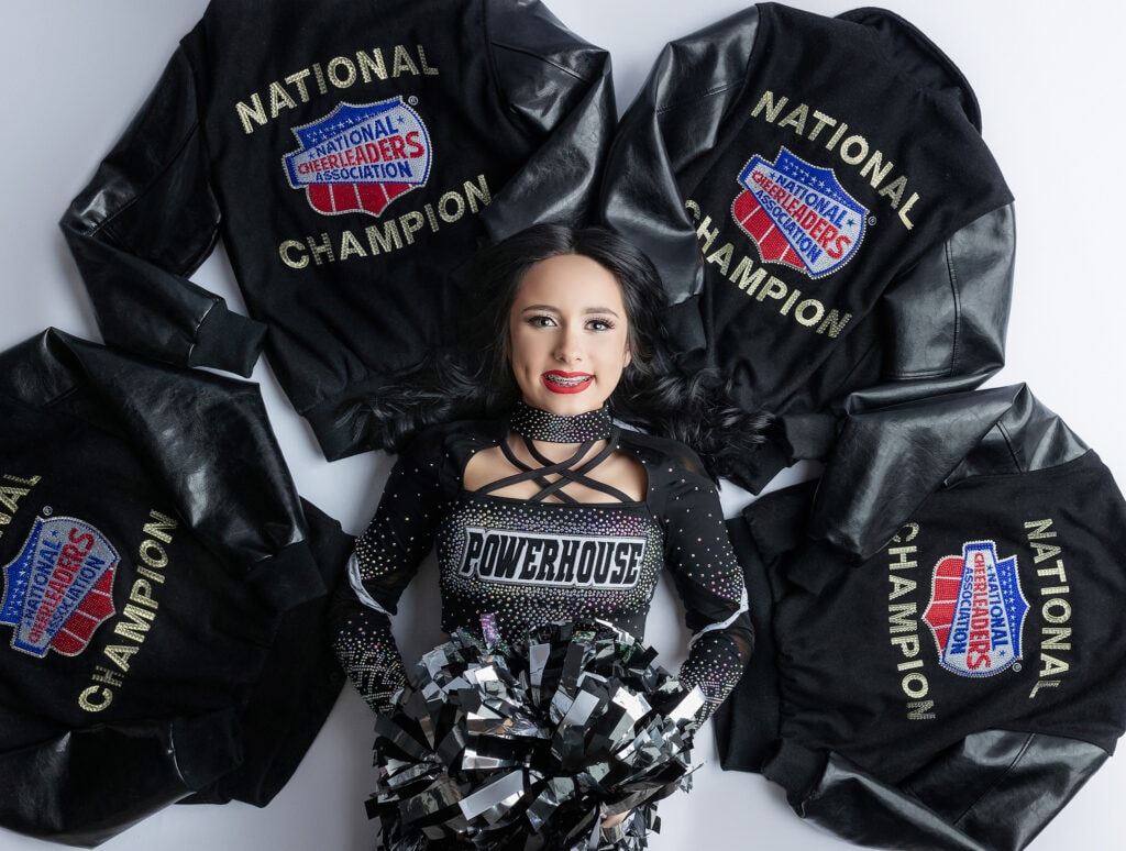 Powerhouse cheerleader with her national championship jackets.