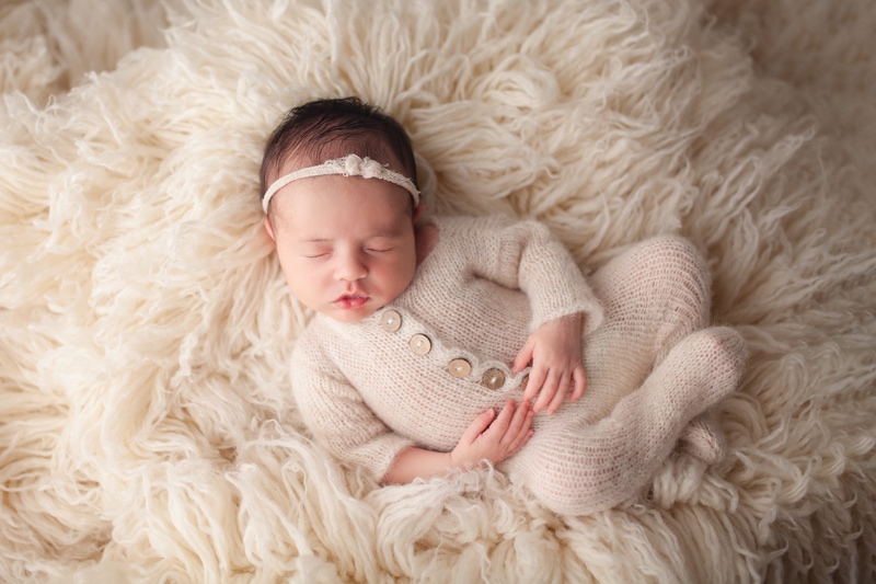 Baby photoshoot, baby in a fur rug
