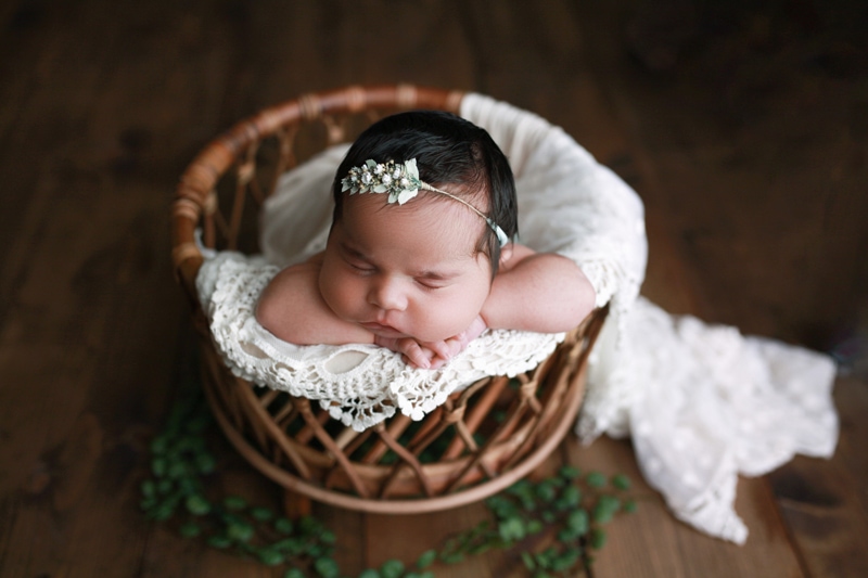 Baby photoshoot, baby in a greenery basket