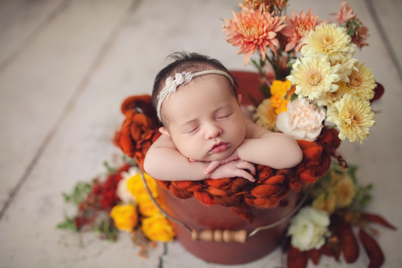 Baby inside bucket with flowers, Austin baby love